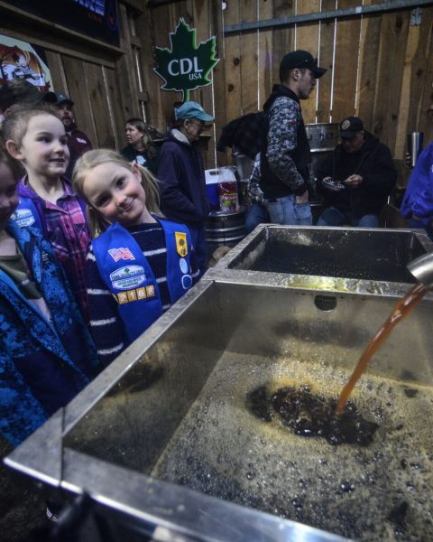 Charlie Robb Jr., of Robb Family Farm, in Brattleboro, talks about the sugaring process to a troop of the Girls Scout during the Vermont Maple Open House Weekend on March 26, 2022. Kristopher Radder — Vermont Country Magazine.