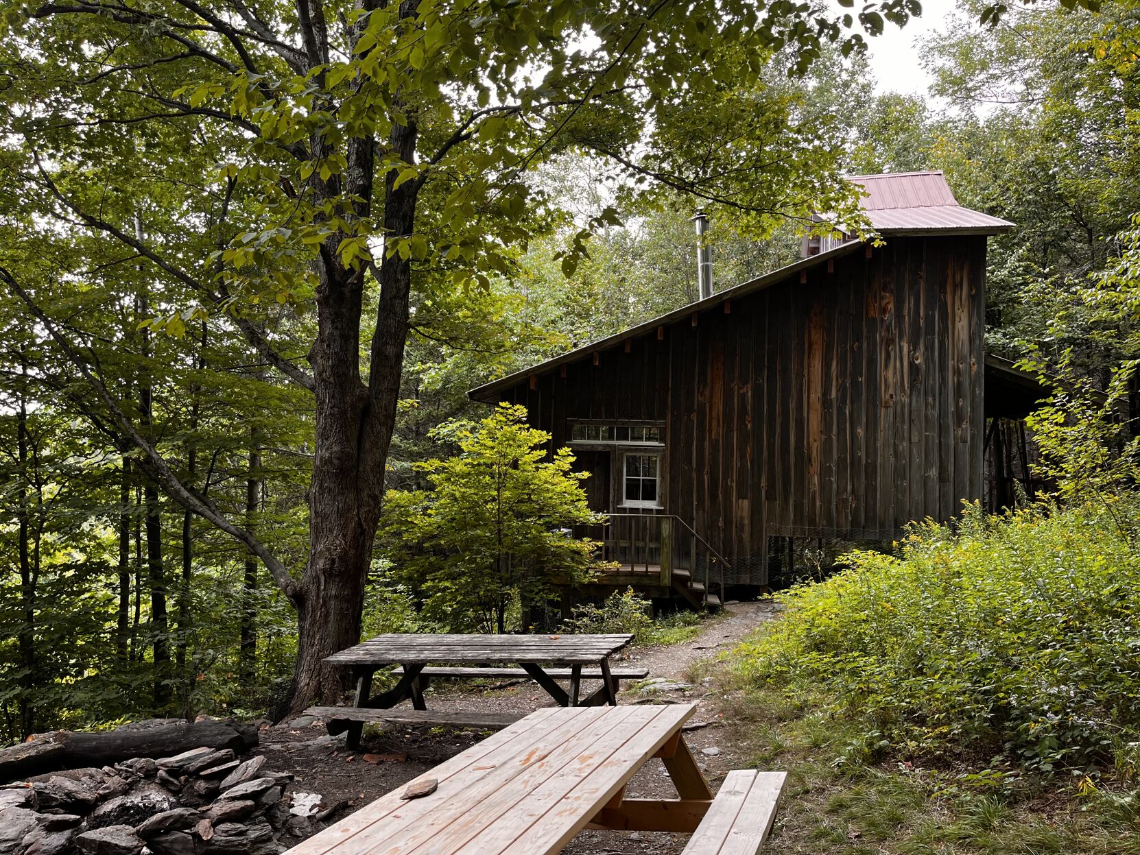 Ned’s Place is the perfect cabin for stargazing while roasting marshmallows over a campfire. Inside, you might find artwork left behind by previous campers. Photo provided by Hadley Stock.