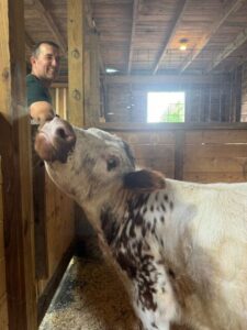 Owner Brian Bradford gives cuddler Biscuit a good scratch on the ear.