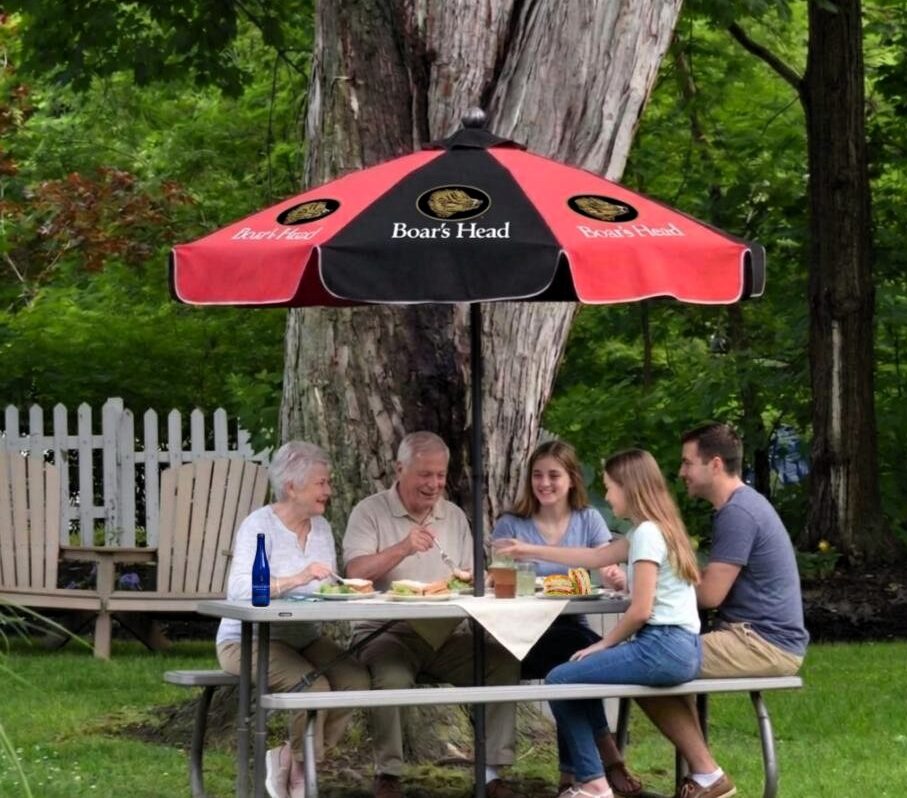 family eating at picnic table
